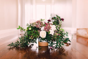 rustic flower arrangement handthrown pottery burgundy and white jasmine ranuncula